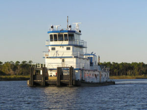 River 120′ towboat on water